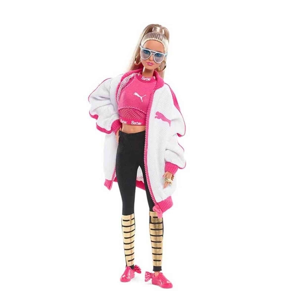 Sportig Barbie-docka för flickor i rosa och svart sportdräkt.
