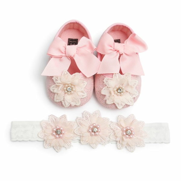 Moderiktig rosa och vit ballerina för flickor med rosett och blomma